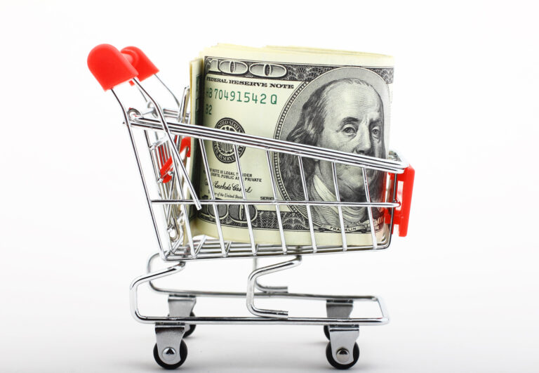 100 dollar bills in mini shopping cart