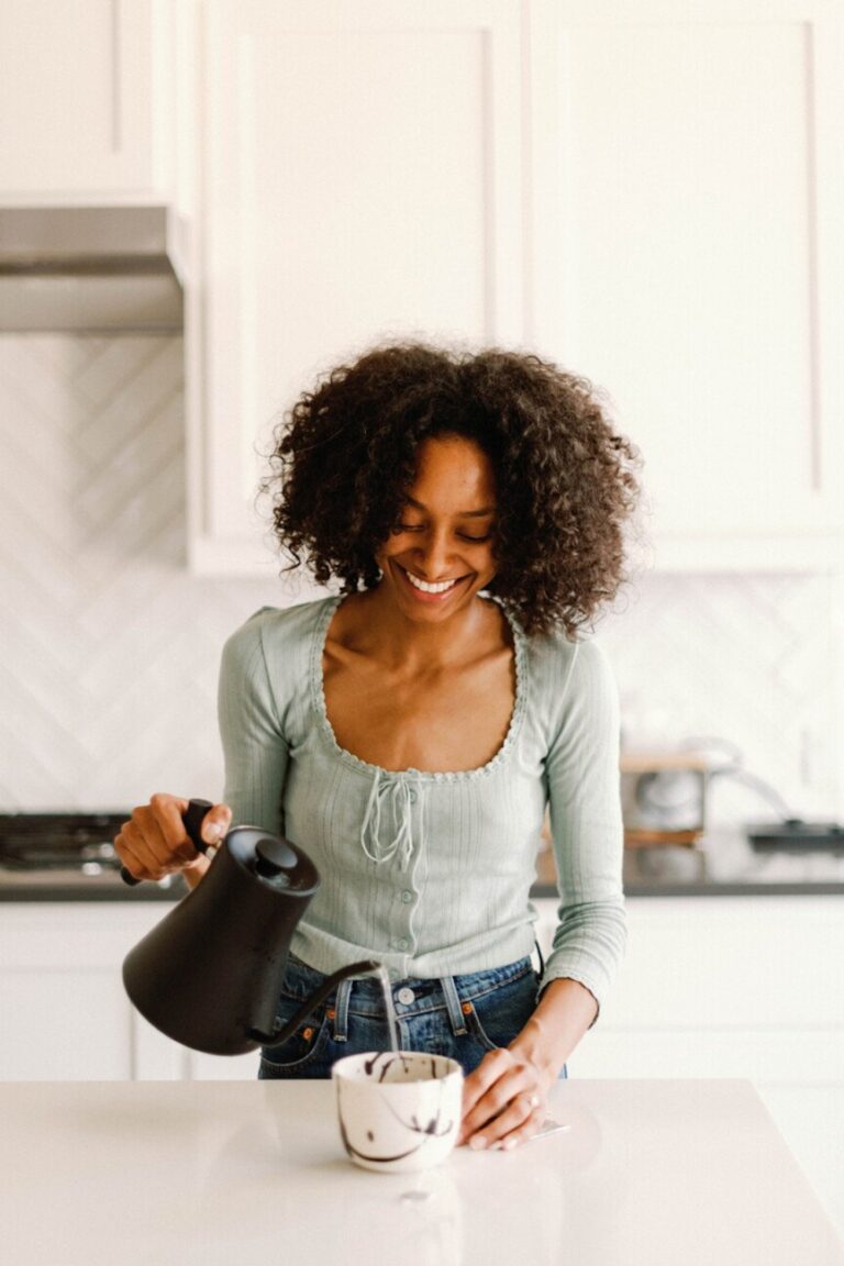 woman brewing best tea for digestion 865x1298
