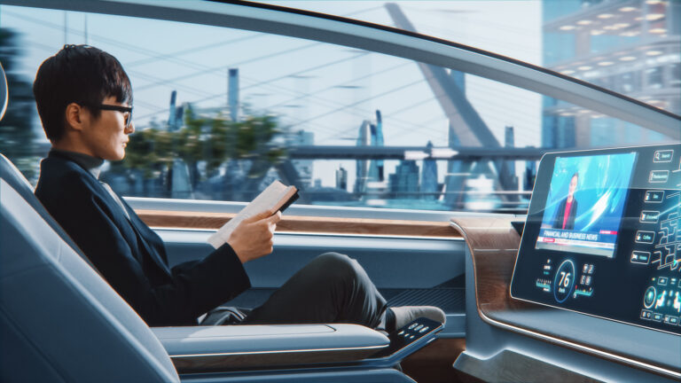 a person riding in a futuristic self driving robotaxi