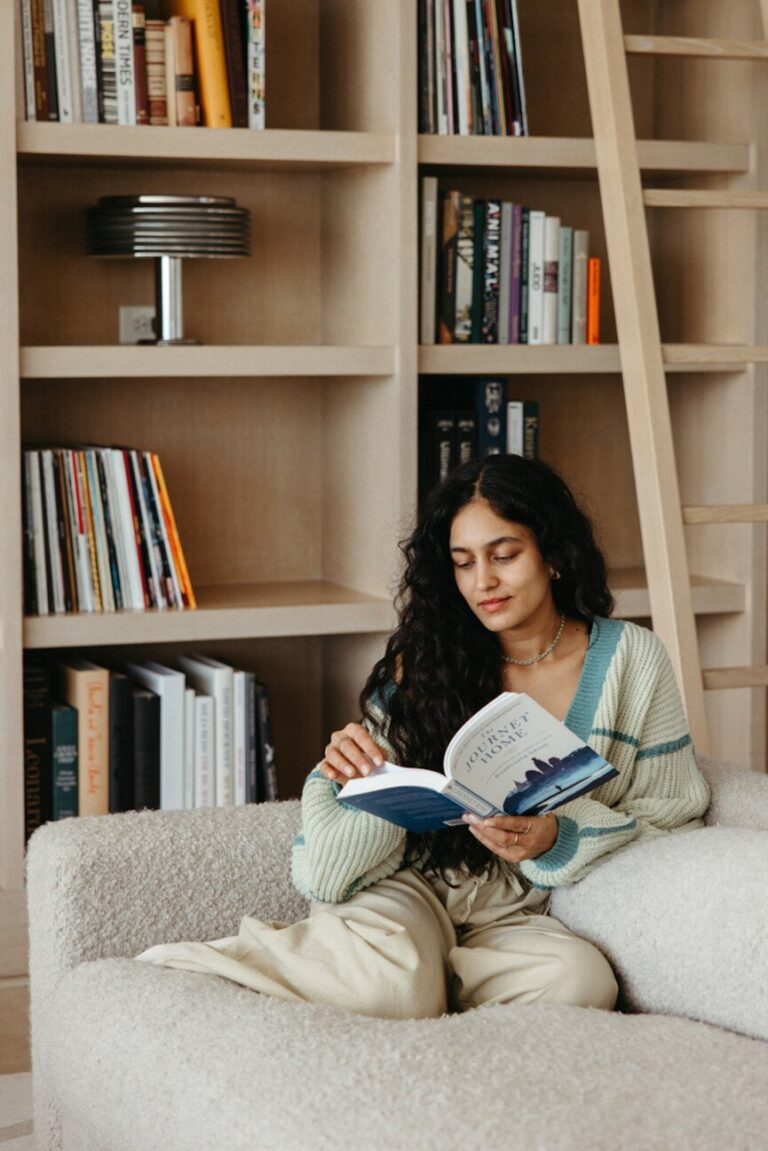 woman reading on couch 865x1296