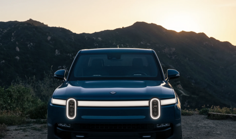 rivian front view at dusk