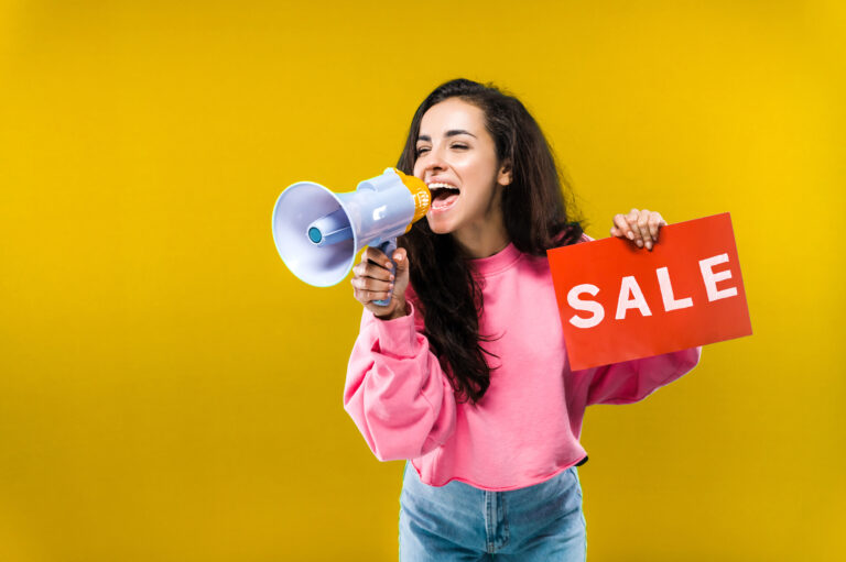 sale sign woman holding megaphone