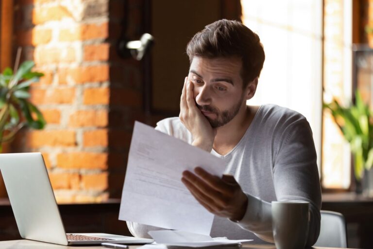 concerned person looking at a piece of paper