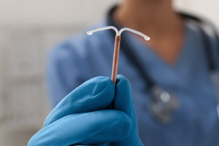 doctor holds long term birth control intrauterine device iud