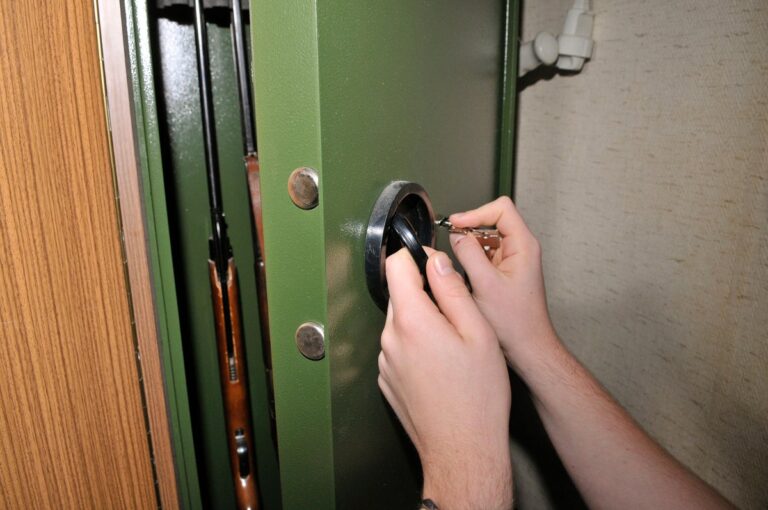 hands opening gun safe