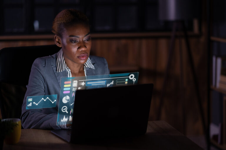 stock market person looking at computer charts