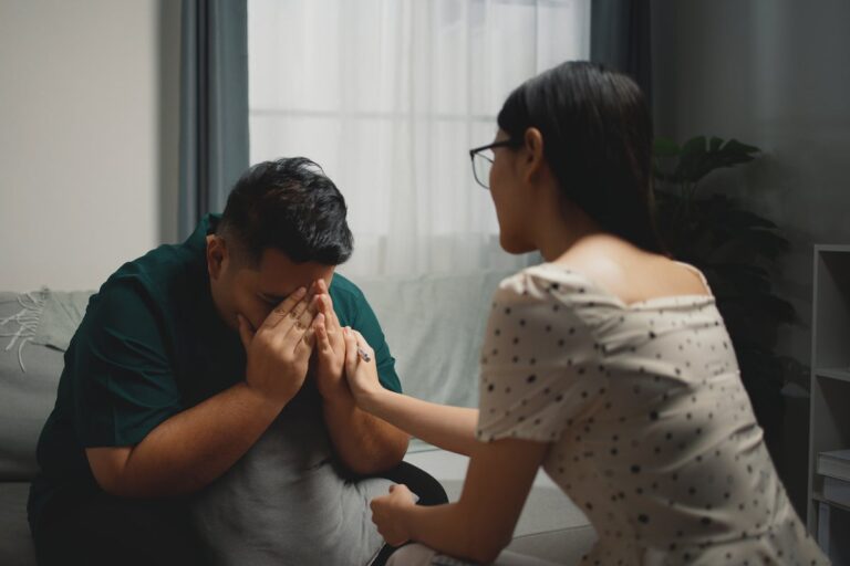 woman comforts distressed man