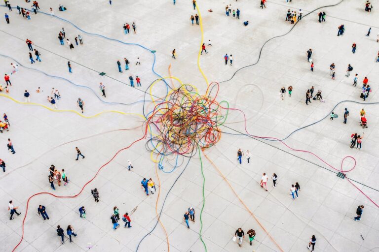 colorful threads tangled amongst crowd of people